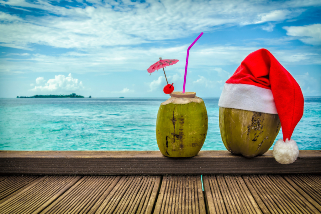 coconut drinks Christmas island-style beach views Santa Hats