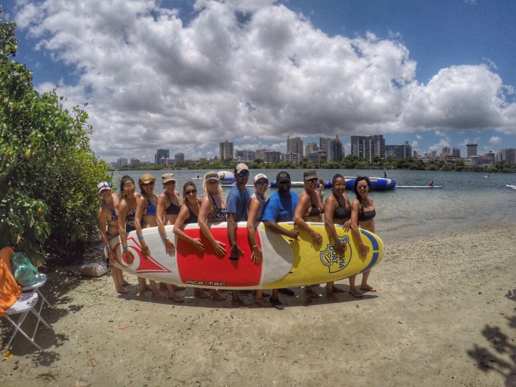 island girlfriends friendship island life woman on a rock Puerto Rico Condado paddleboarding SUP girls