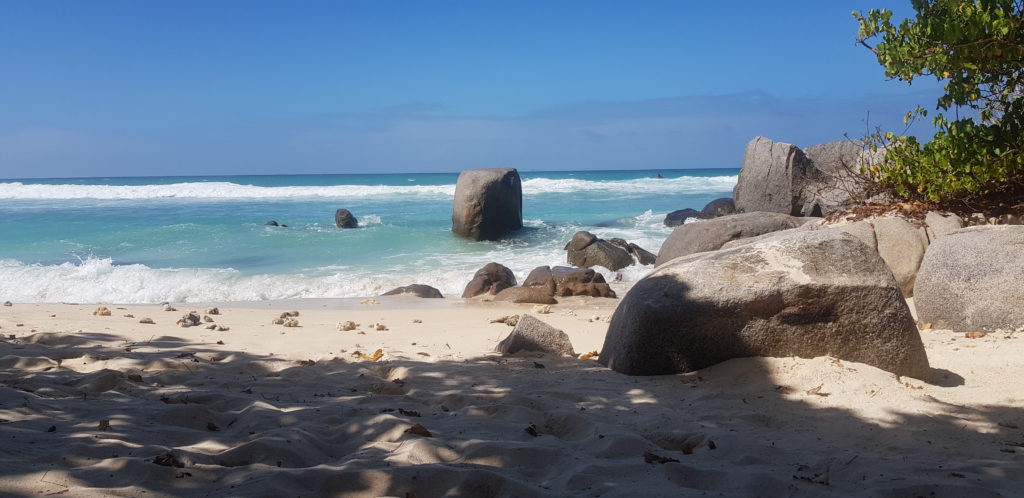 Mahe Seychelles beach boulders island living women islanders